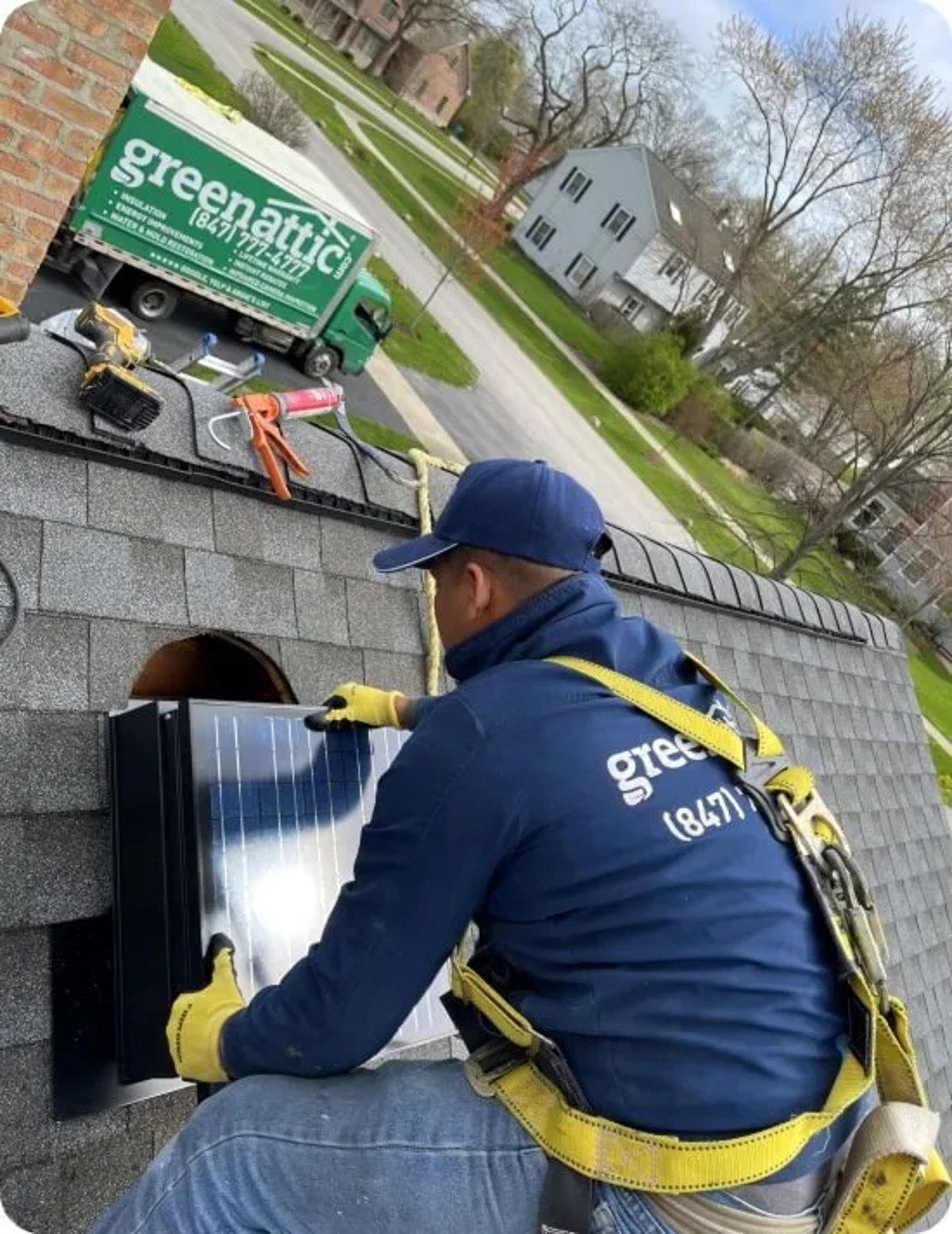 Green Attic Worker Installing Powered Vents