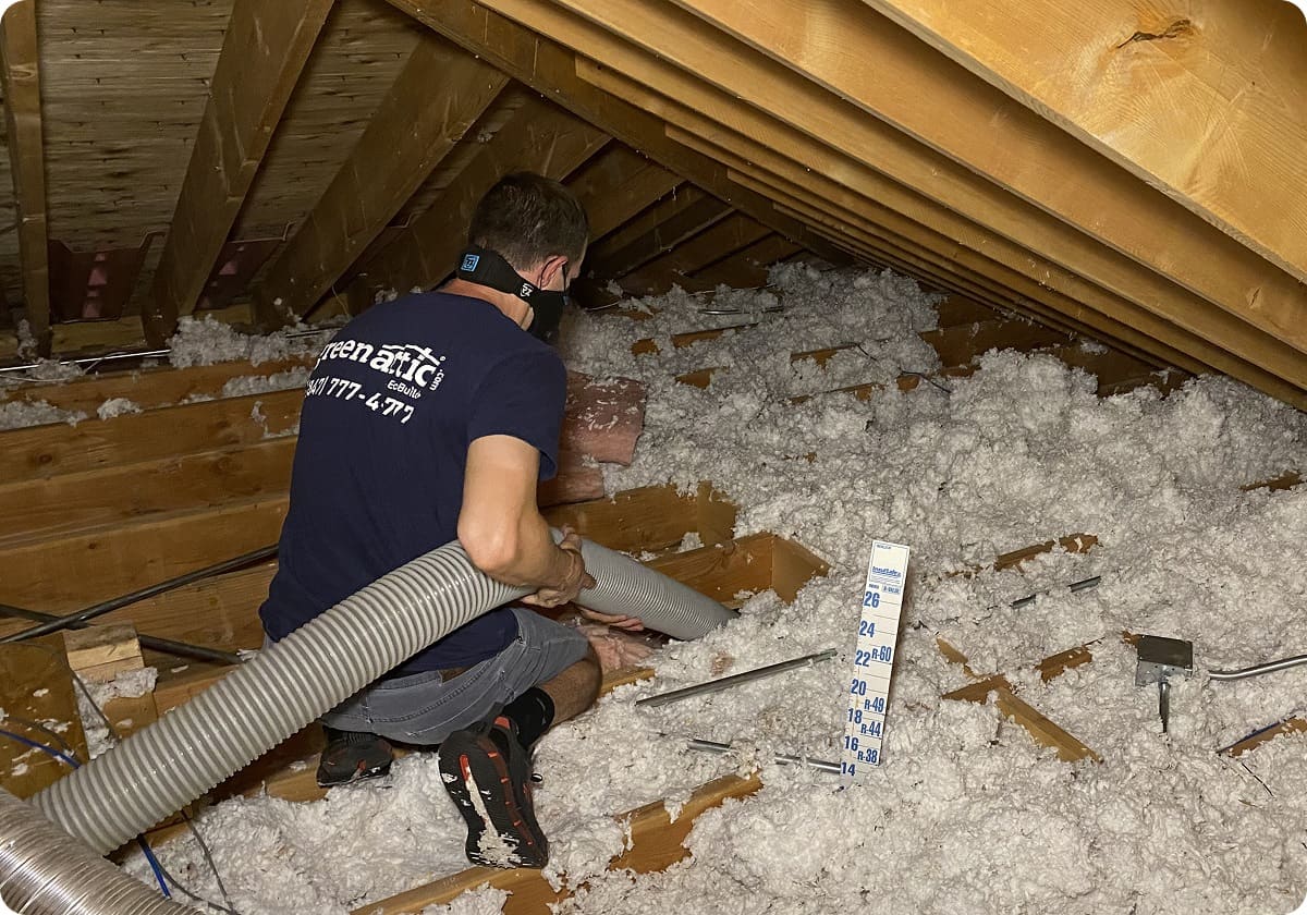Green Attic Insulation Removal Worker