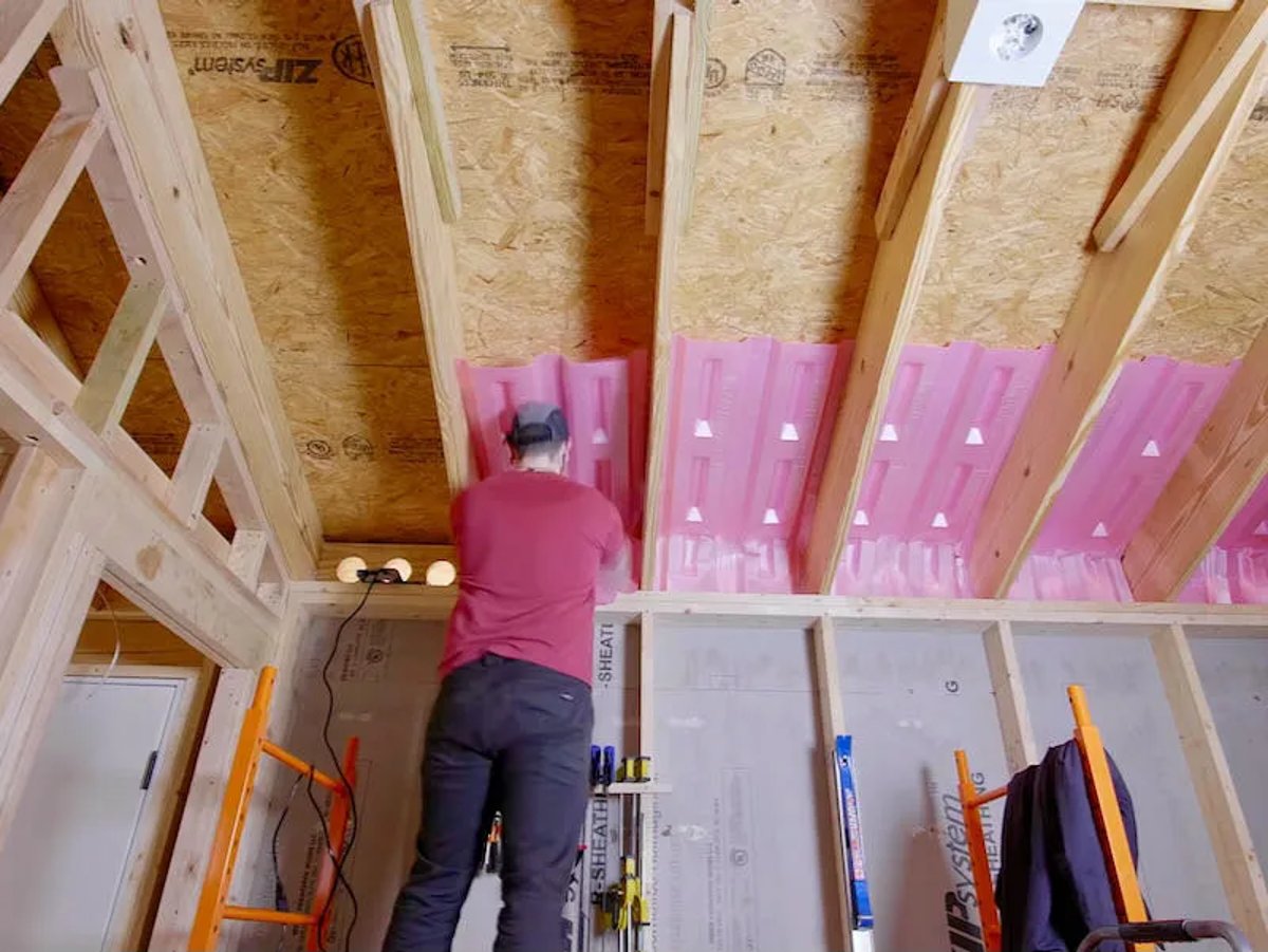 Professional Contractor Installing Baffles