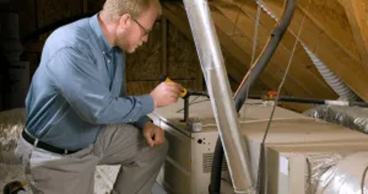 Attic Inspector Looking At Hvac