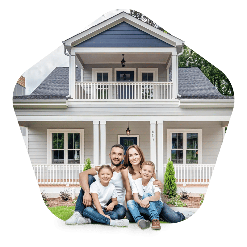 Happy family in front of their house